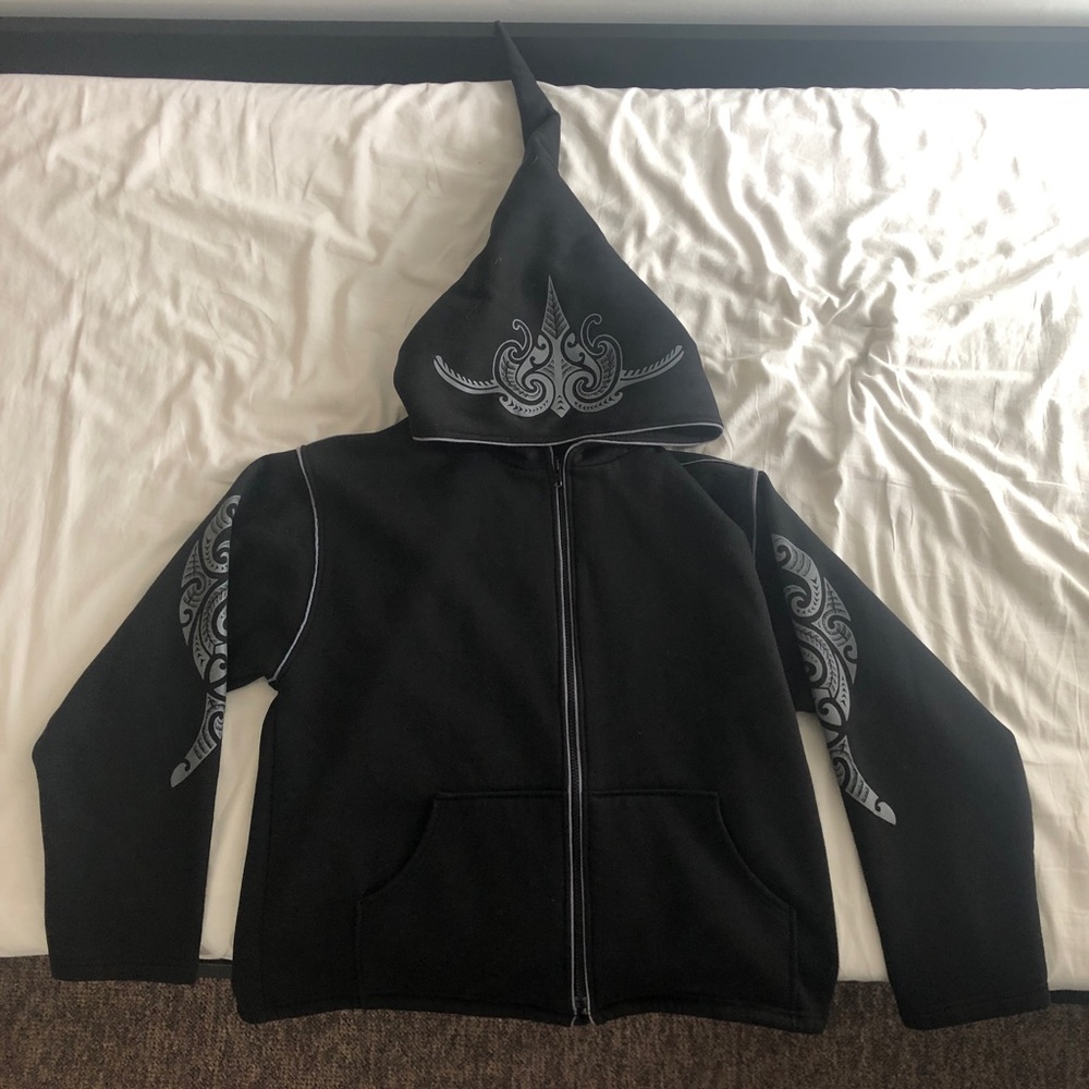 Black jacket with tattoo design and dwarf hood
